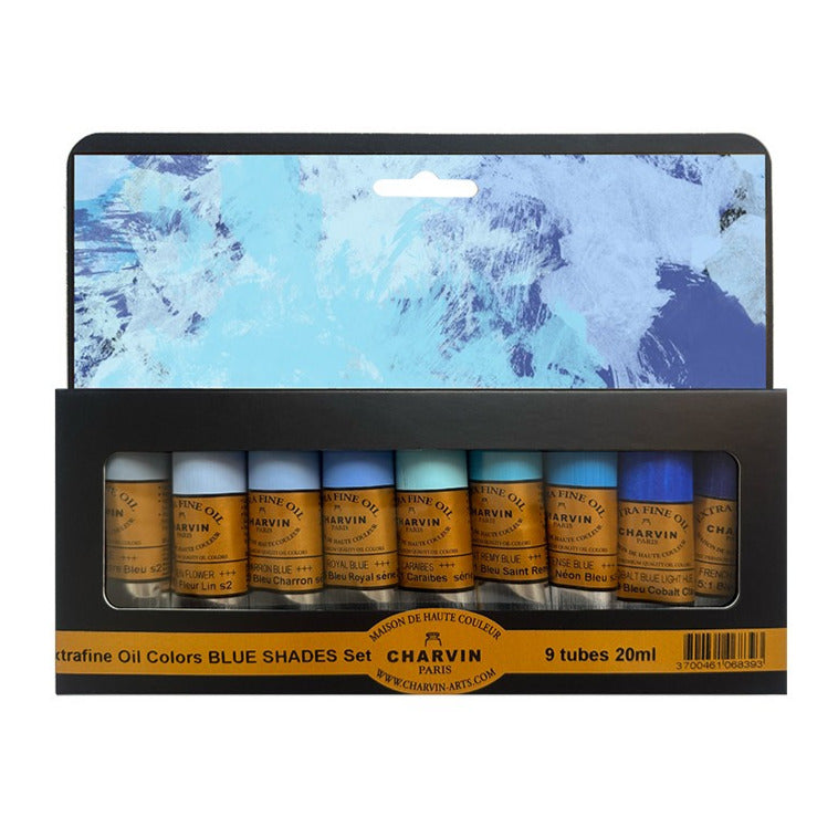 Packaging of Charvin oil colors in blue shades with a scenic background