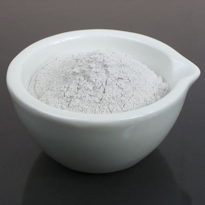 Volcanic Rock in powdered form, which is used to provide tooth in grounds.